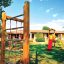 Al Club Eurovillage, l'area giochi per bambini è immersa nel verde, con altalena, scivoli e tanti altri giochi divertenti.